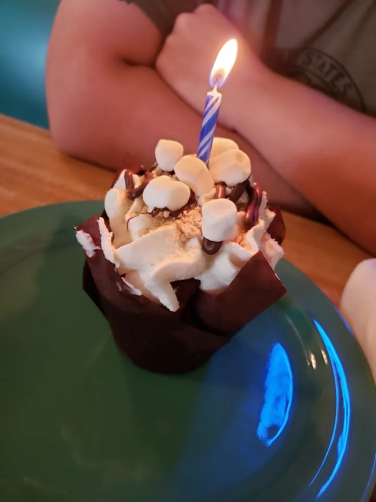 S'Mores Cupcake with a Candle as We Mentioned We Ate Celebrating the Husband's Birthday